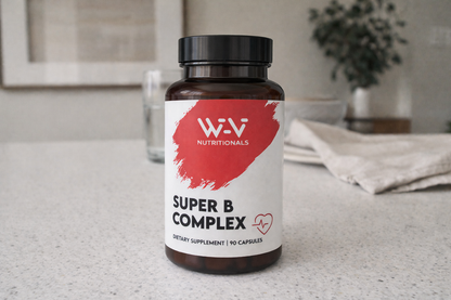 Supplement bottle labeled 'Super B Complex' by Wi-Vi Nutritionals on a countertop.